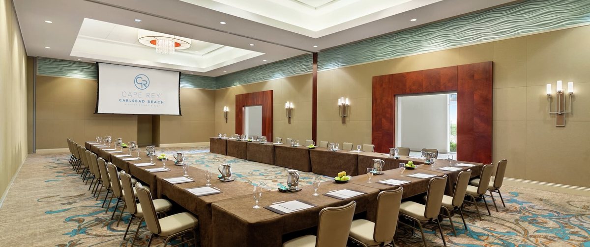 Shearwater 4 and 5 at Cape Rey Carlsbad Beach set with a long conference table and two screens