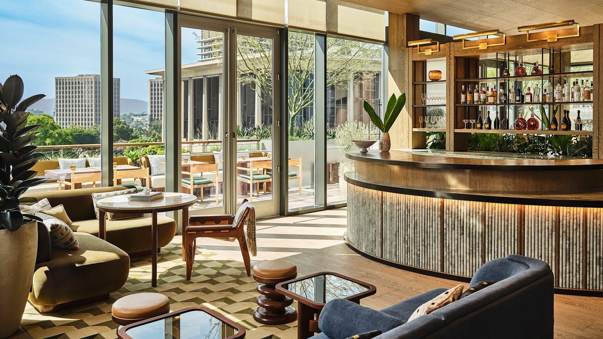 Sed at Conrad Los Angeles with lounge seating, floor-to-ceiling windows and a private bar