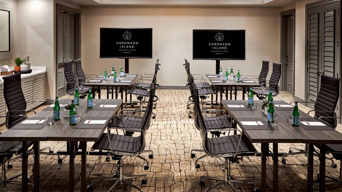 A Coronado breakout room at Coronado Island Marriott Resort & Spa set classroom style facing two displays