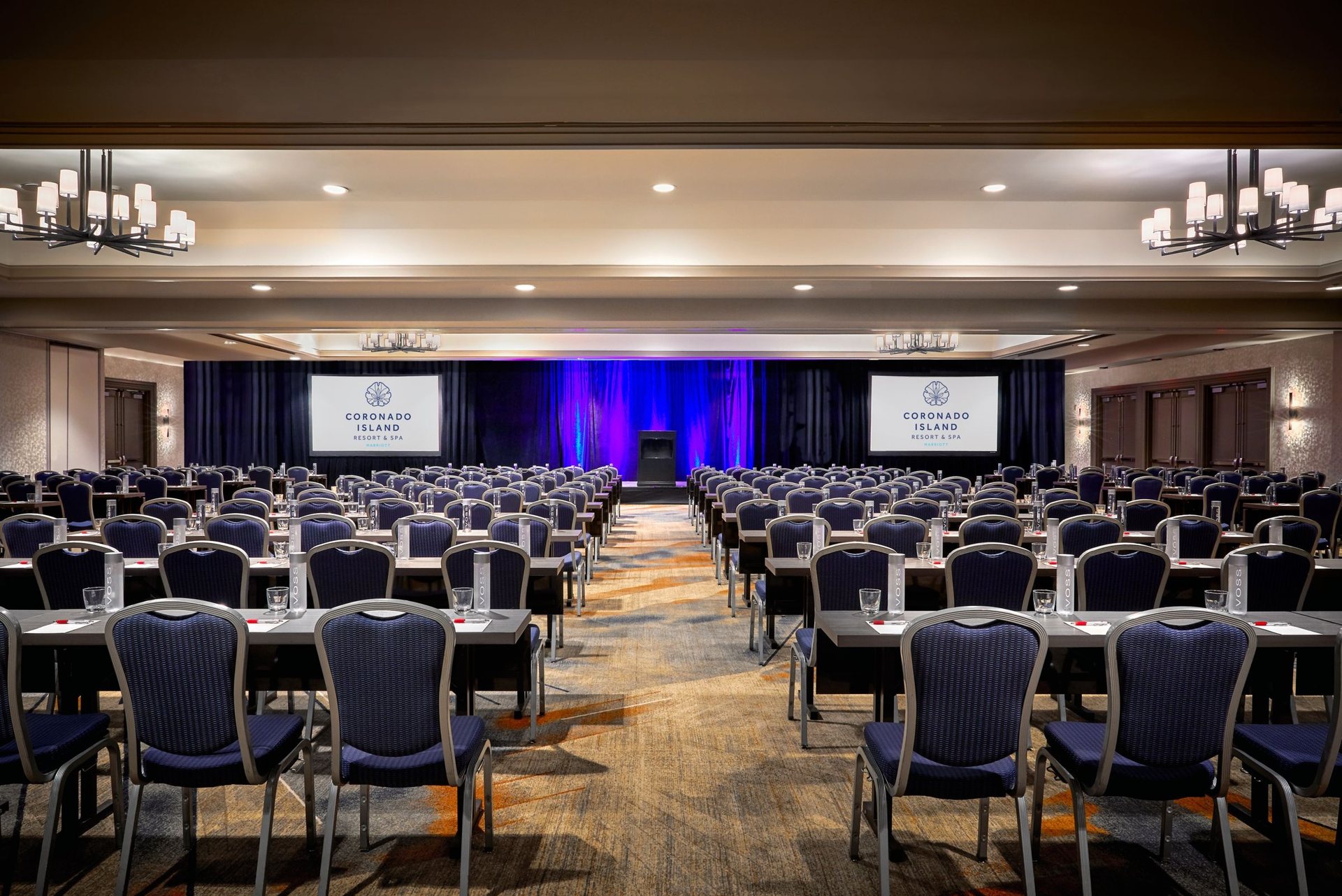 The Coronado Ballroom at Coronado Island Marriott Resort & Spa set theater style facing a stage with two screens