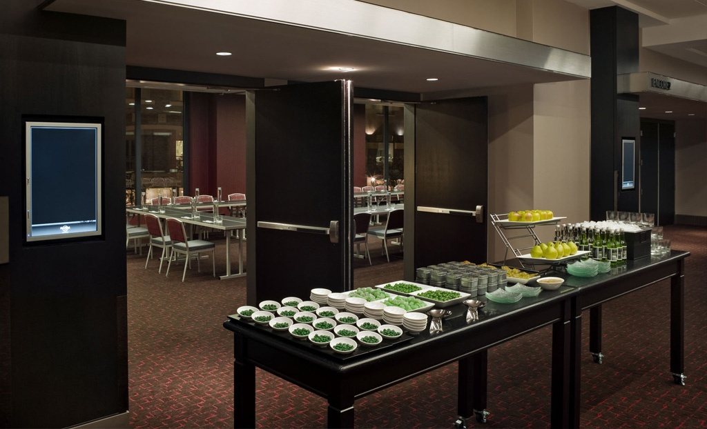 Abbey Road prefunction space at Hard Rock Hotel San Diego with a buffet set along the music memorabilia