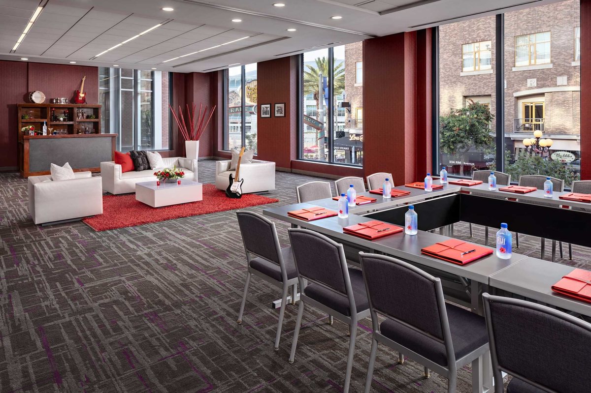 The Encore meeting room at Hard Rock Hotel San Diego with conference tables, lounge seating and windows