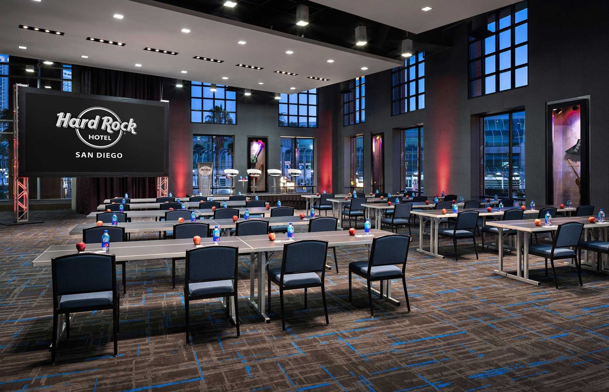 The Edge at Hard Rock Hotel San Diego with a Hard Rock screen, tall windows and banquet seating