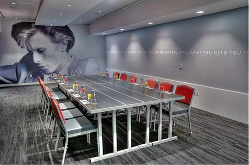 Fame at Hard Rock Hotel San Diego set for a meeting with red chairs and a music mural
