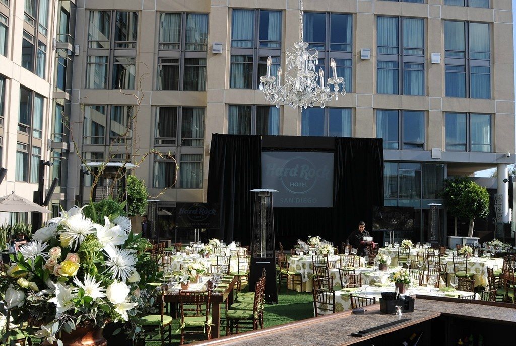 Woodstock rooftop terrace at Hard Rock Hotel San Diego set for an outdoor event with a screen and flowers
