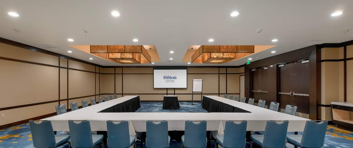 The Catalina Ballroom at Hilton Irvine/Orange County Airport set U-shape facing a projection screen