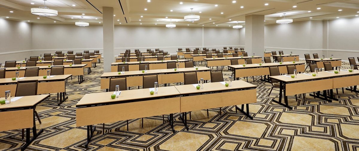 The California Ballroom at Hilton Pasadena set classroom style with long tables