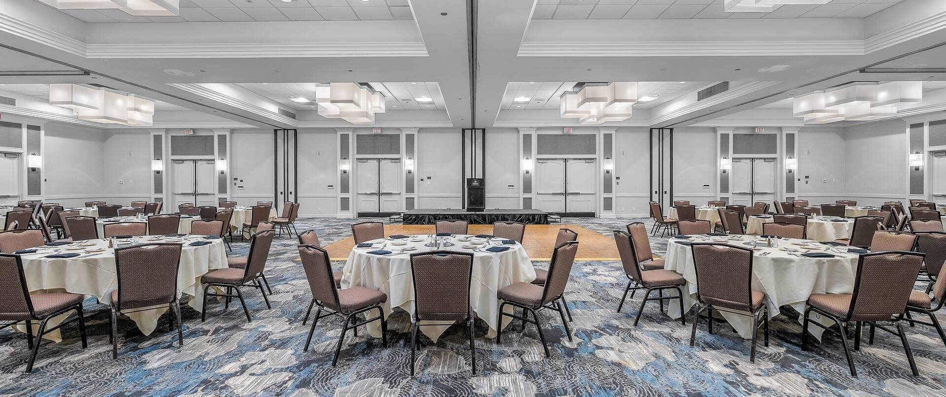 The Del Mar Ballroom set for a banquet with round tables and chairs around a dance floor