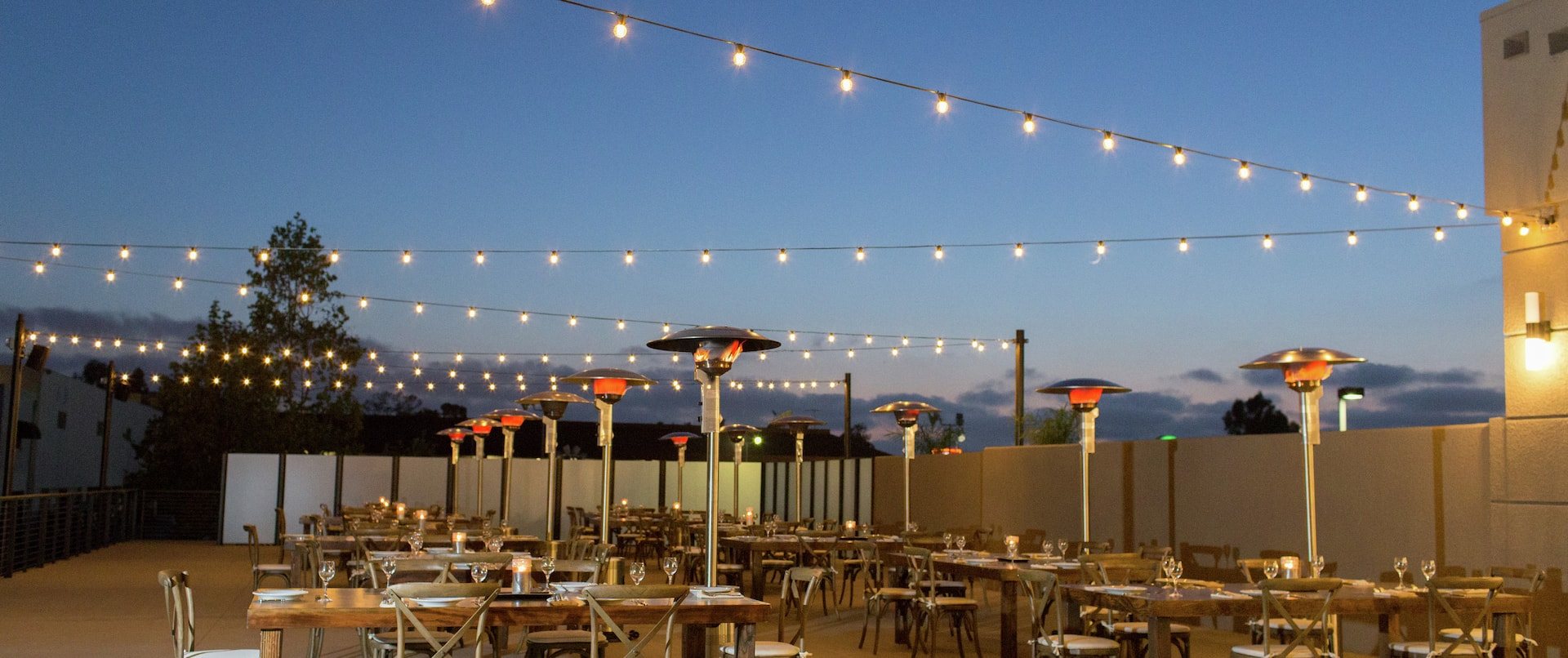 The outdoor event deck at Hilton San Diego Mission Valley in the evening
