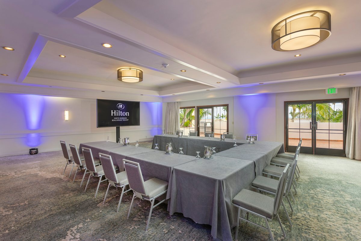 The Fiesta meeting room at Hilton Santa Barbara Beachfront Resort set U-shape facing a display