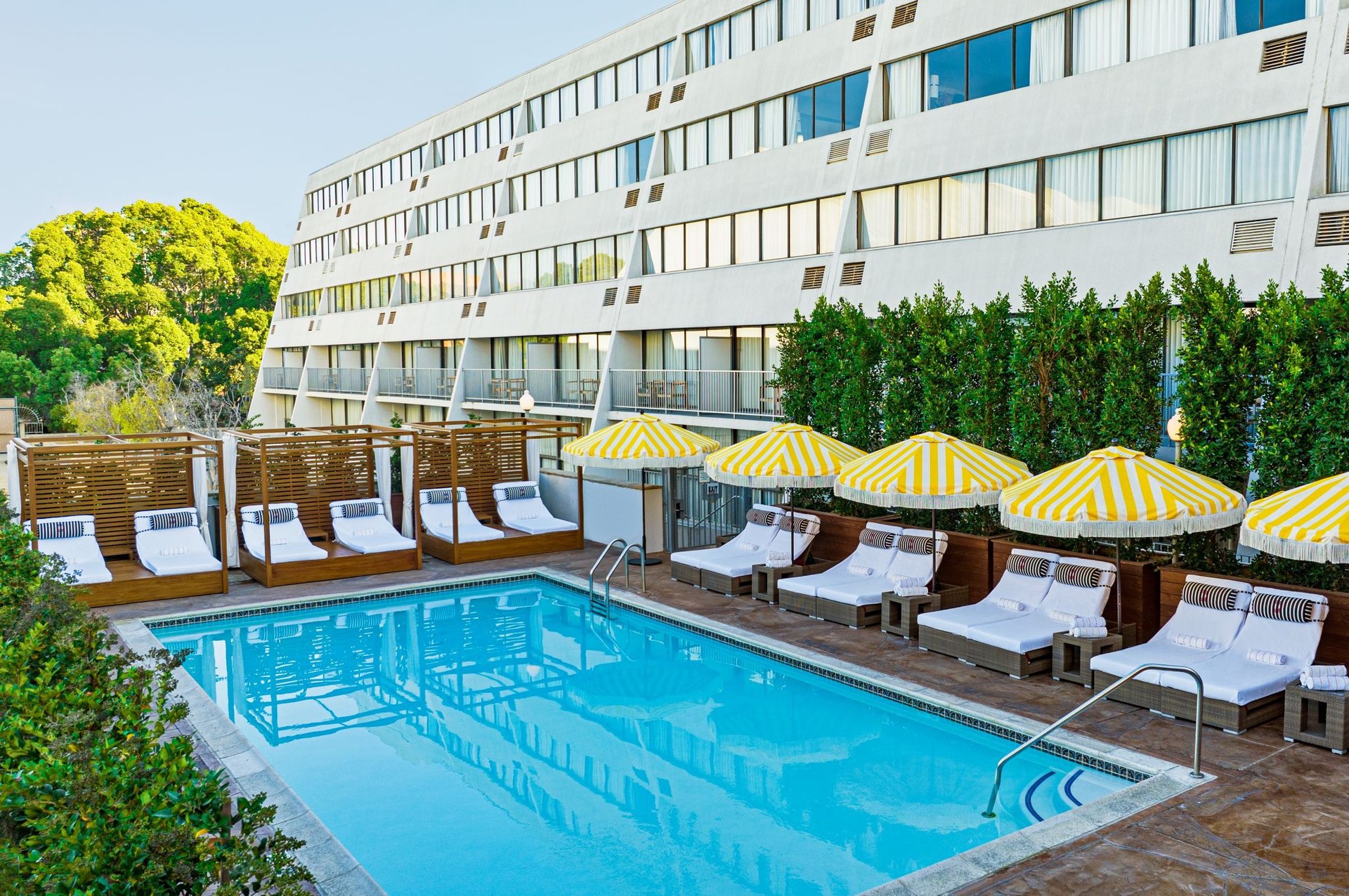The pool at Hotel Dena, Pasadena with yellow umbrellas