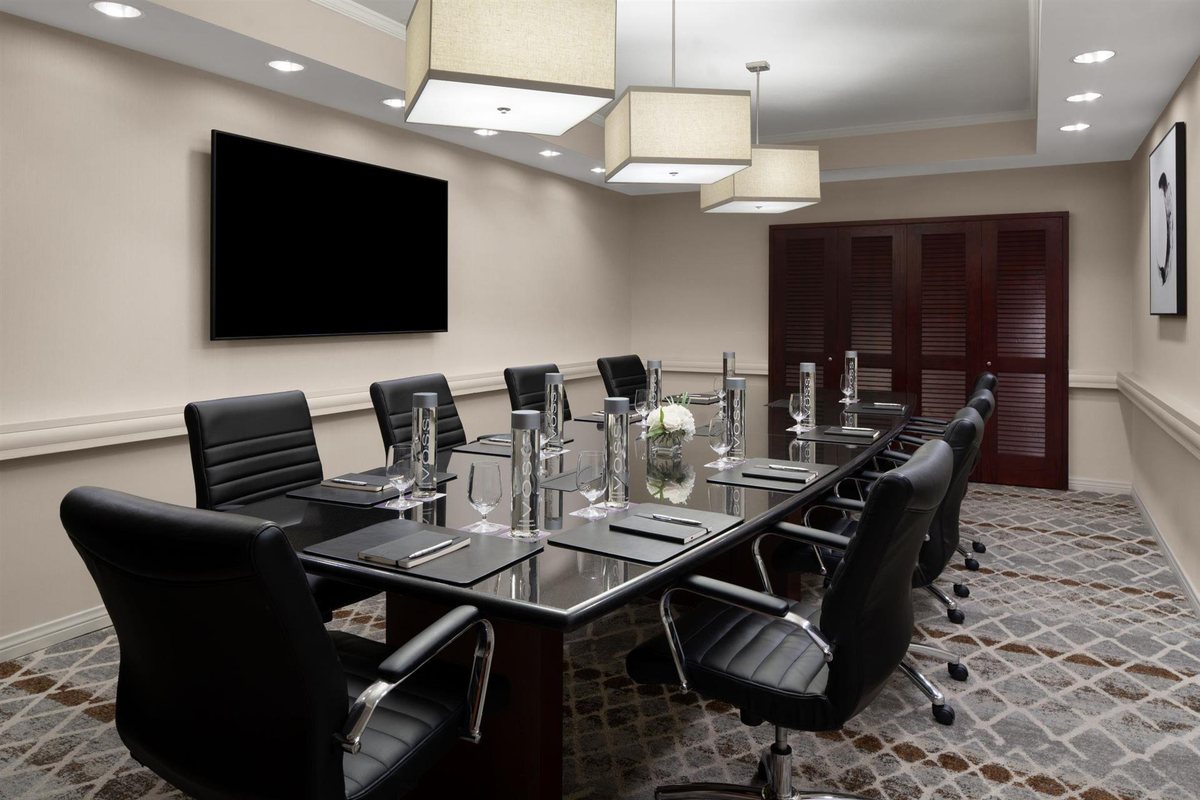 The Chairman's Boardroom at Hyatt Regency Westlake with a long table and display