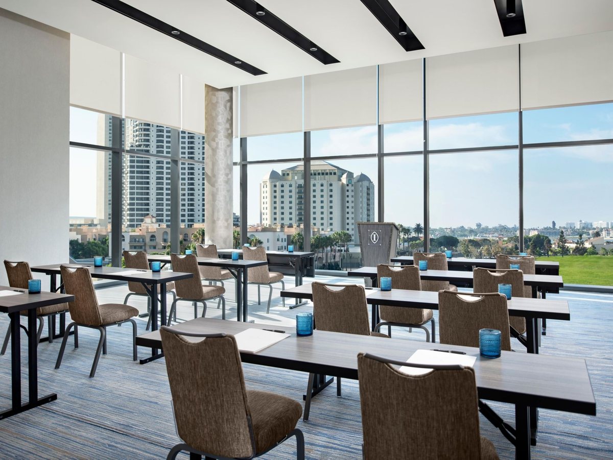 The Harbor room at InterContinental San Diego set classroom style beside floor-to-ceiling windows