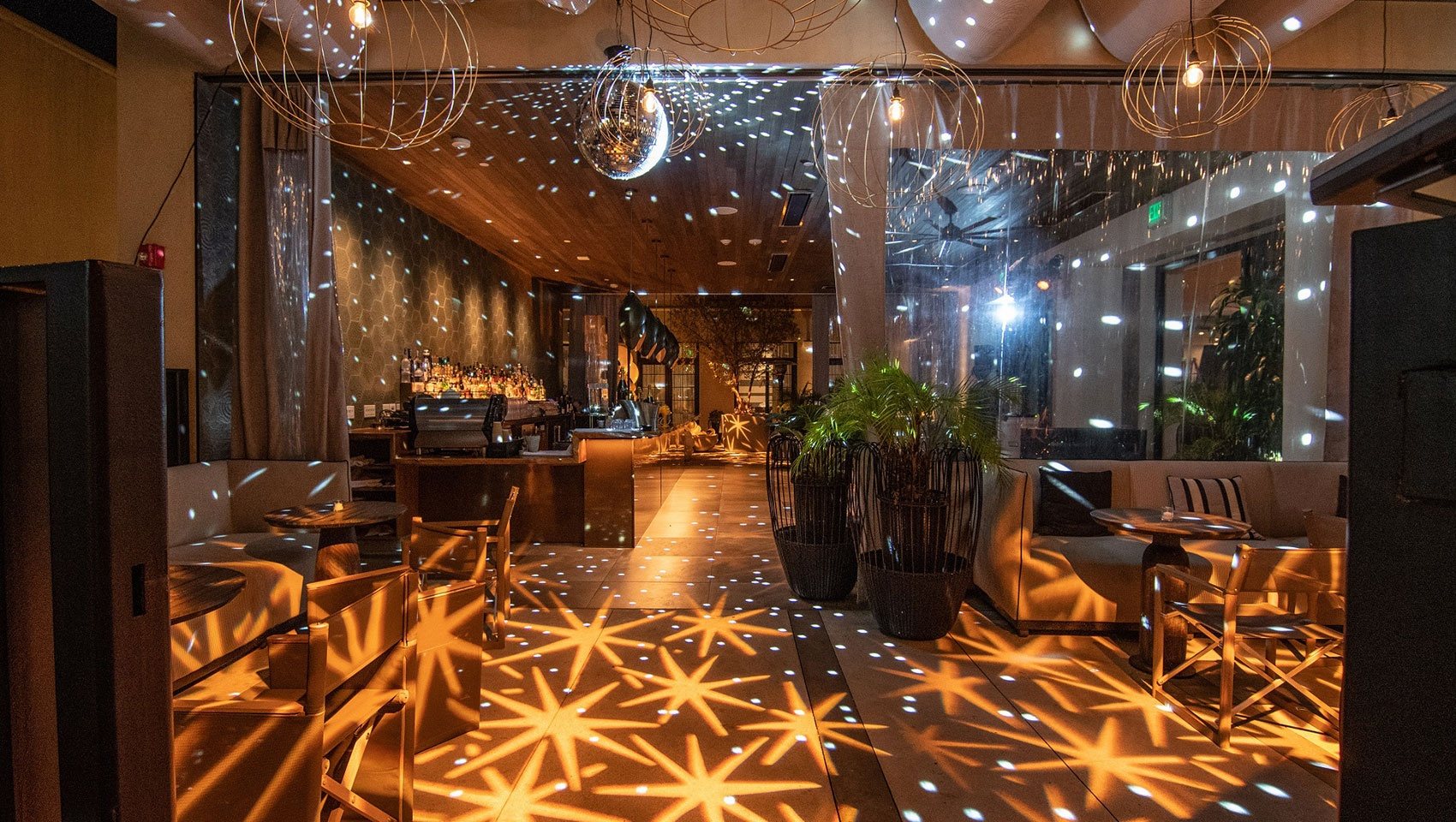 The courtyard bar at Kimpton La Peer Hotel at night