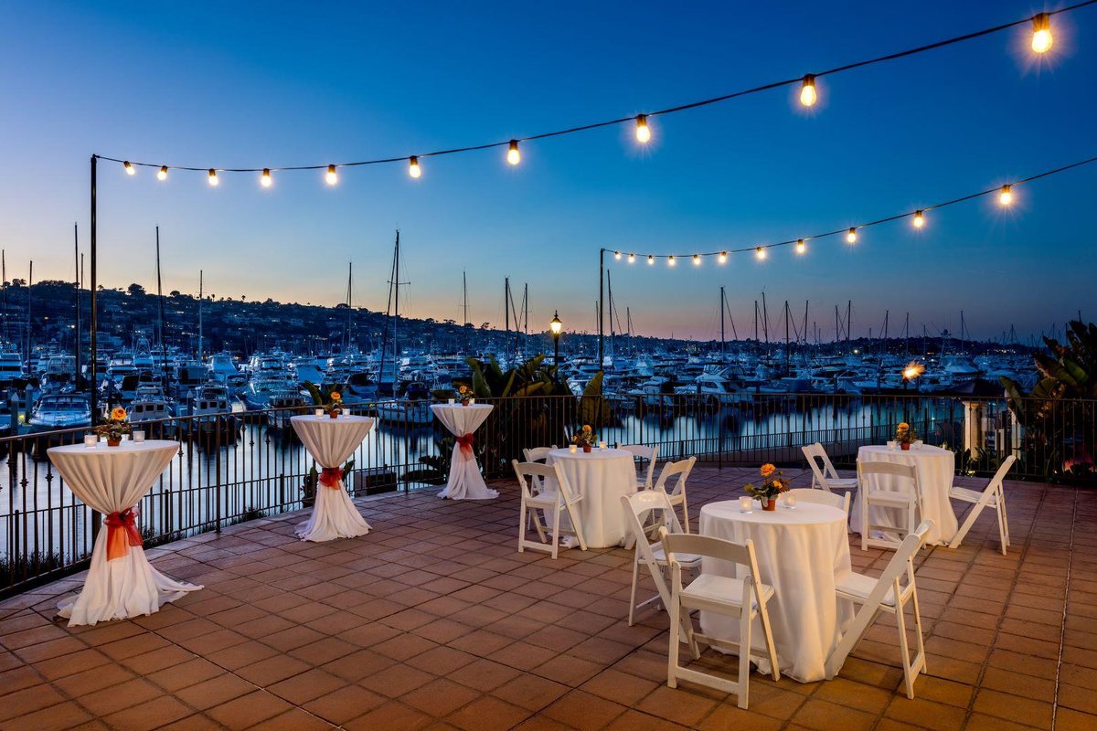 The Point Loma Circle Patio at Kona Kai San Diego Resort with string lights over the marina