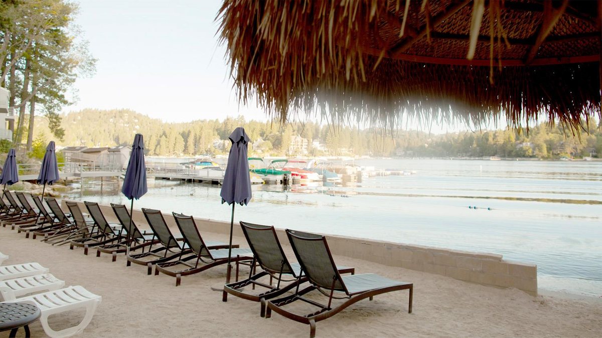 The Resort Beach at Lake Arrowhead Resort and Spa with lounge chairs on the sand