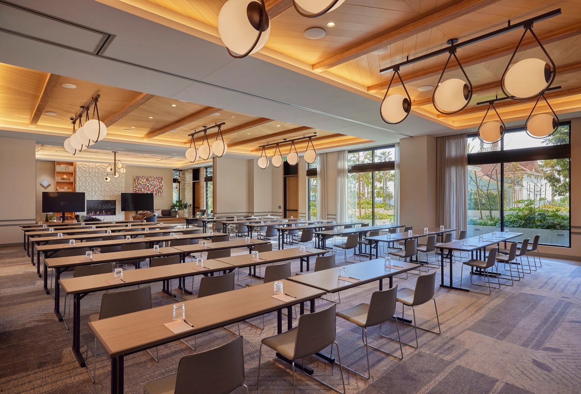 Longboard at Mission Pacific Beach Resort set classroom style under wood ceilings with ocean-facing windows