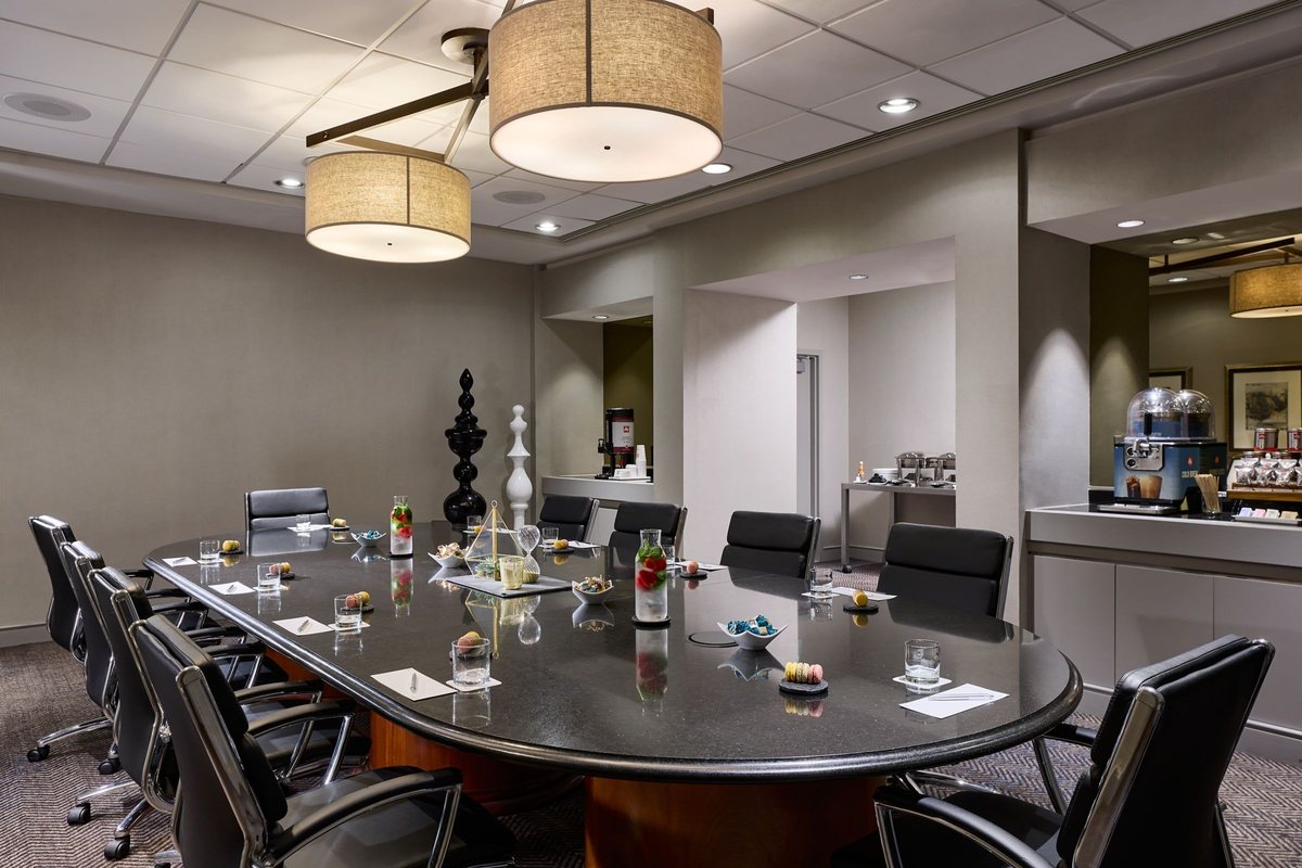 Boardroom at Renaissance Los Angeles Airport Hotel with an oval conference table and executive chairs