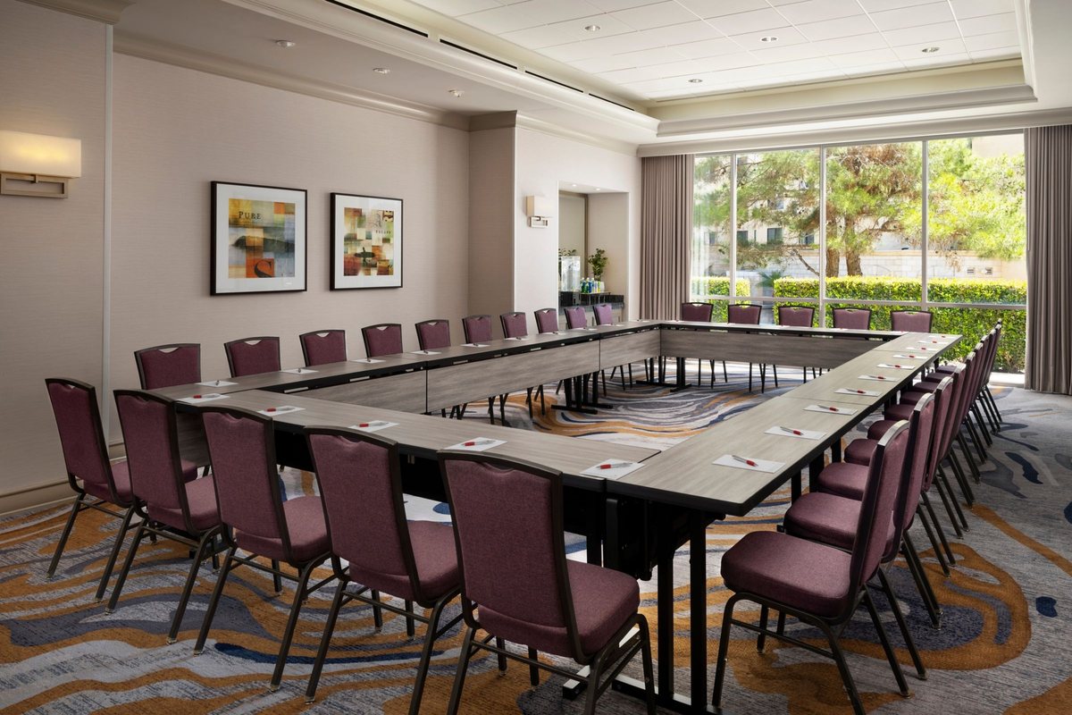 The Coronado Room at San Diego Marriott Del Mar with tables set in a square