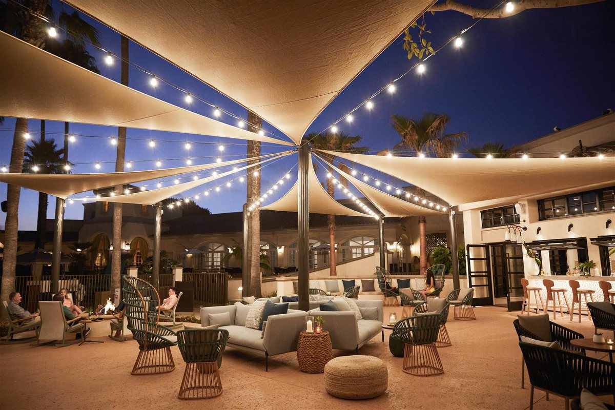 Plaza del Sol at San Diego Mission Bay Resort with lounge furniture under shade sails