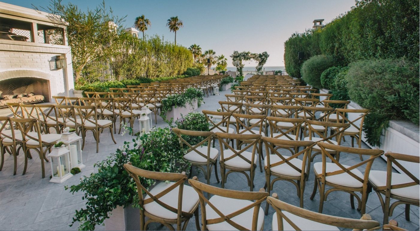 Rows of chairs set for a ceremony on the Pacific Terrace at Shutters on the Beach