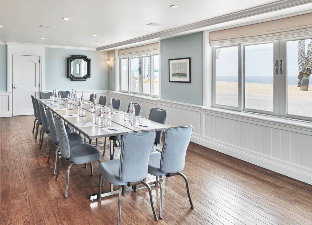 Oceanside set with a long conference table and ocean views
