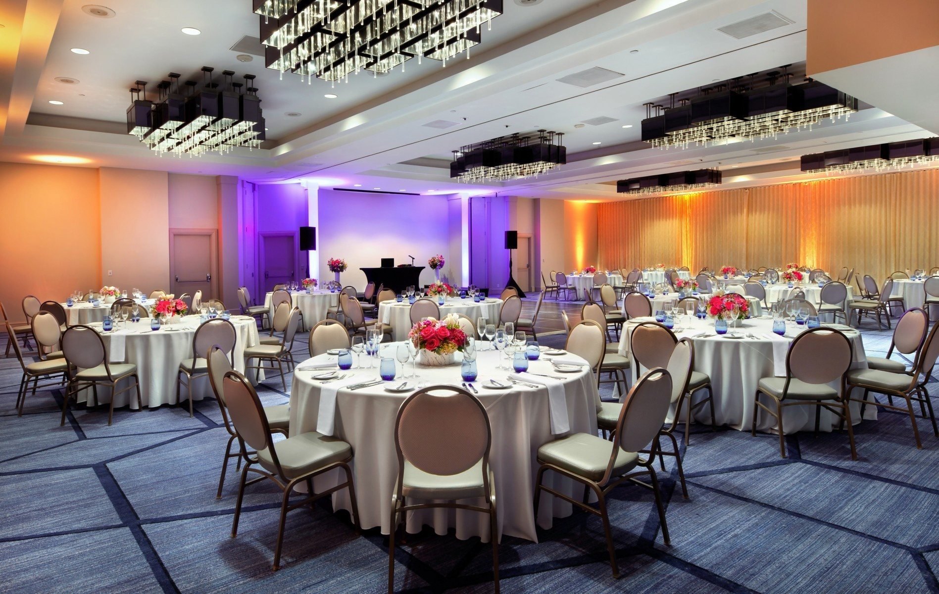 The Beverly Ballroom at Sofitel Los Angeles at Beverly Hills set with rounds and purple uplighting