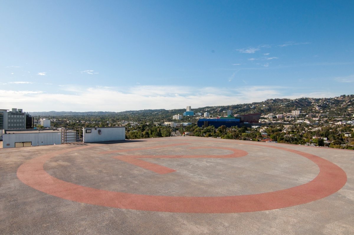 The rooftop helipad at Sofitel Los Angeles at Beverly Hills with a view of the Hollywood Hills