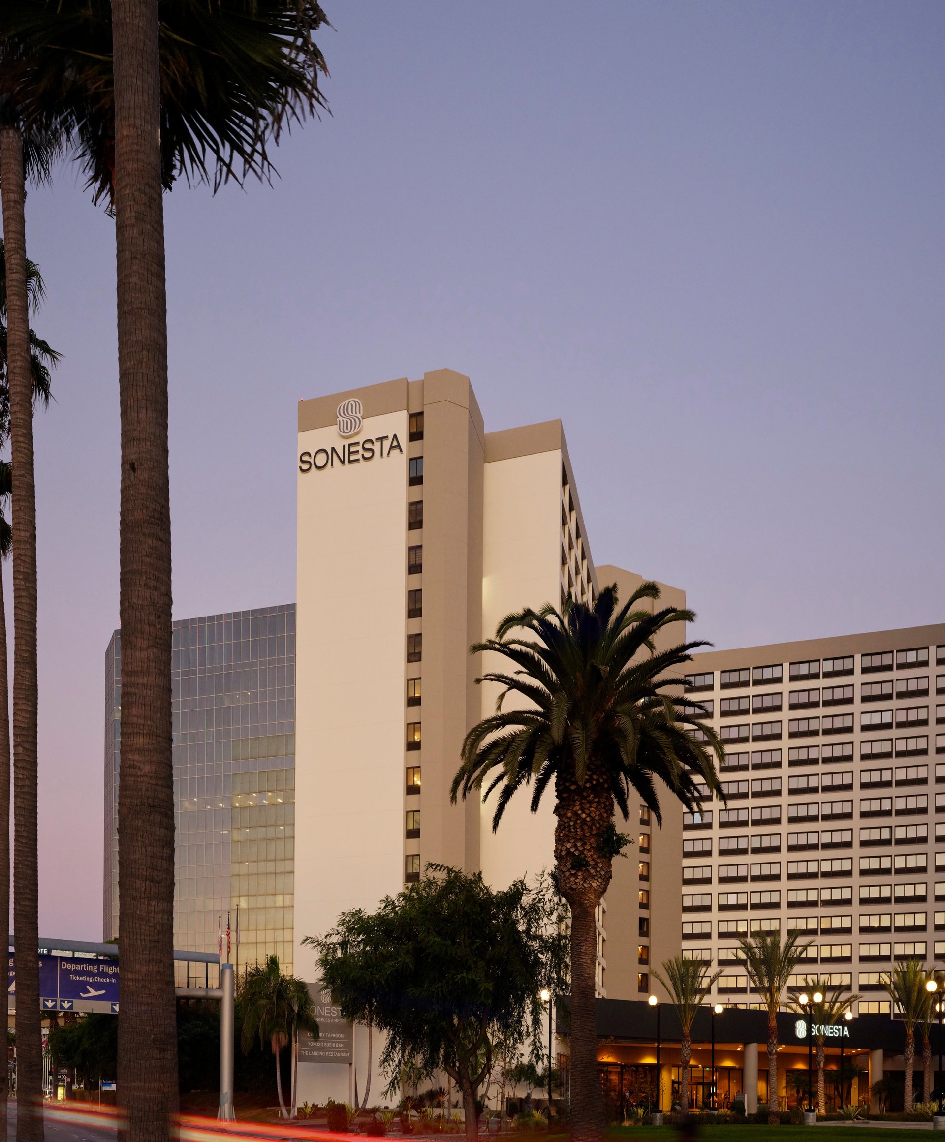 The exterior of Sonesta Los Angeles Airport LAX on West Century Boulevard at dusk