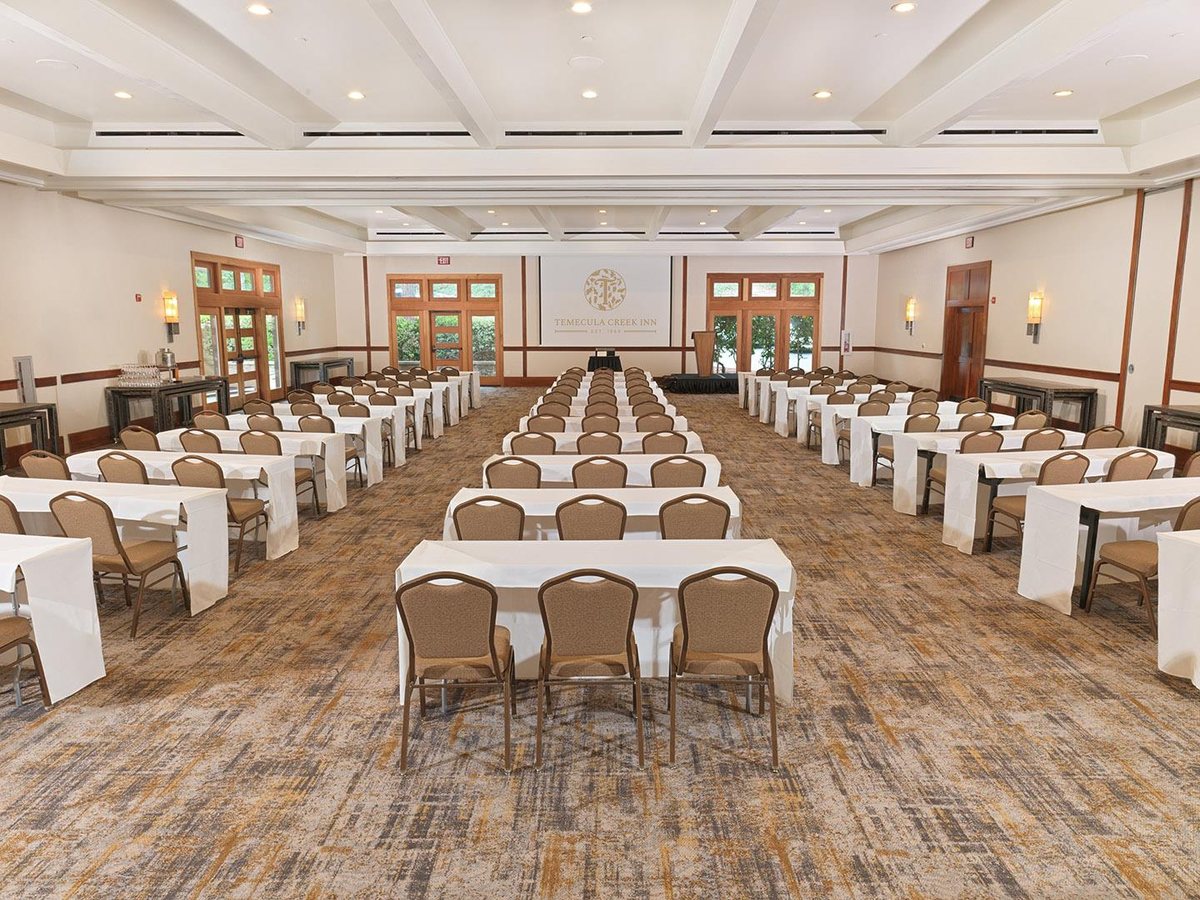 The Olive Ballroom at Temecula Creek Inn set with long banquet tables