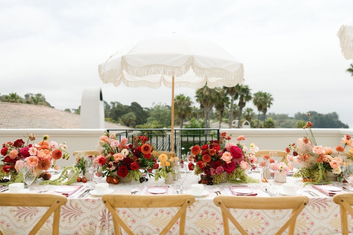 A floral table set on the Rotunda Balcony with ocean views