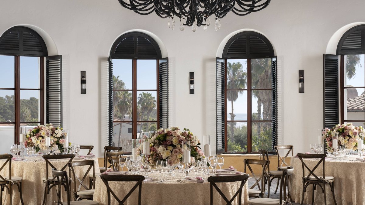 The Rotunda Room set with round tables under tall arched windows