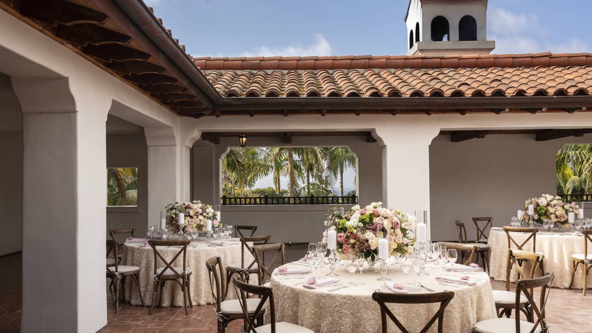Round tables set on the covered Rotunda Terrace