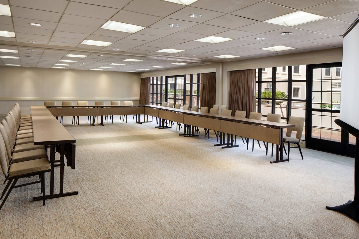 The Harbor room set with long tables along windows