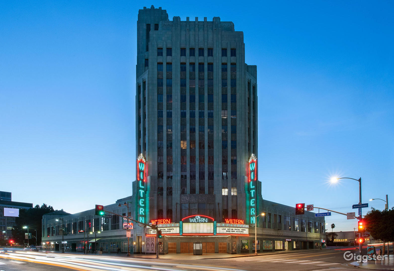 The Wiltern Art Deco tower and marquee at dusk on Wilshire Boulevard