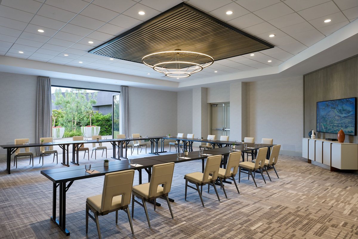 Capri set with classroom tables and natural light from a window wall