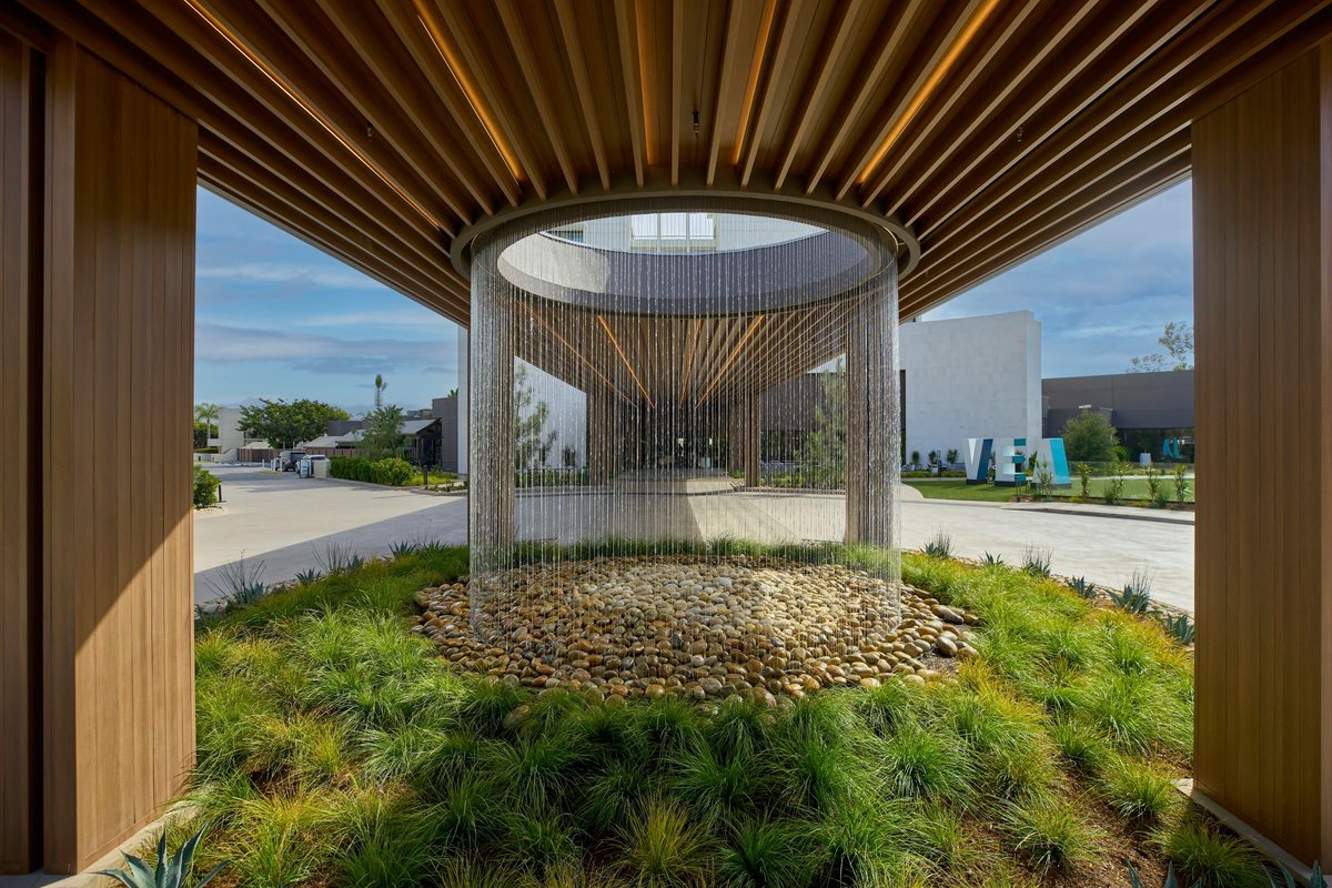 The Oculus, a circular wooden canopy over a water feature at the resort entrance