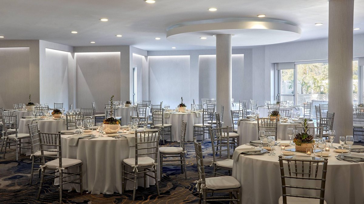 The Emma Wood Junior Ballroom at Ventura Beach Marriott set with round banquet tables and white linens